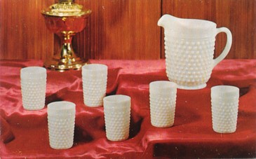 Featured is a promotional postcard depicting a hobnail milk glass water or lemonade set.  Much of today's "vintage" glassware was given away as premiums to customers as an incentive to open bank accounts.  This promotion was for the Wayne Building & Loan Co of Wooster, OH.  The original postcard is for sale in The unltd.com Store.